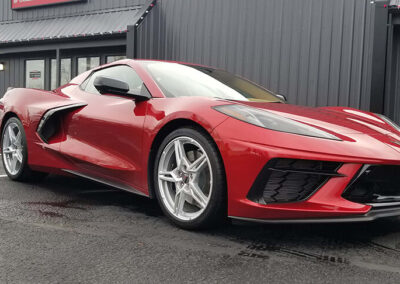 Side view of a red C8 Corvette